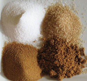 From Top Left Corner, Clockwise. White Sugar, Raw Sugar, Fine Brown Sugar, Rapadura